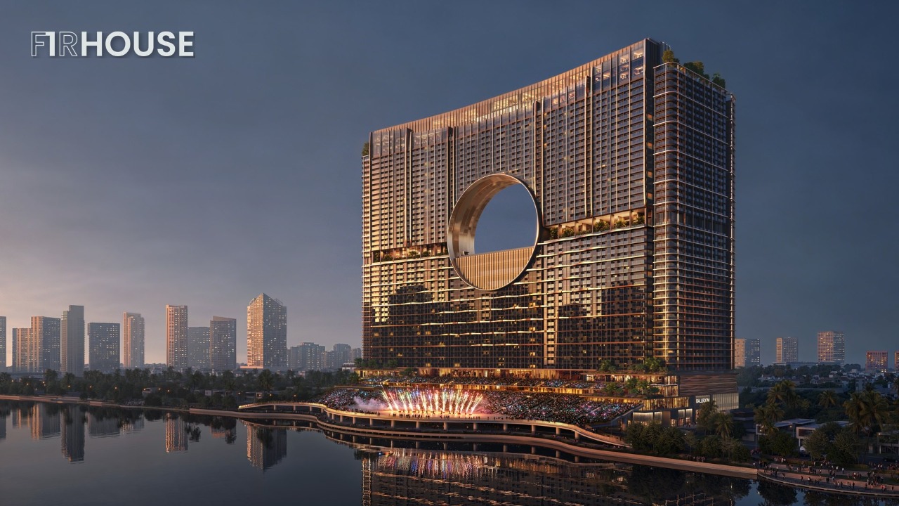 Sun Galaxy Đà Nẵng về đêm bên sông Hàn với vòm Moon Gate phát sáng.